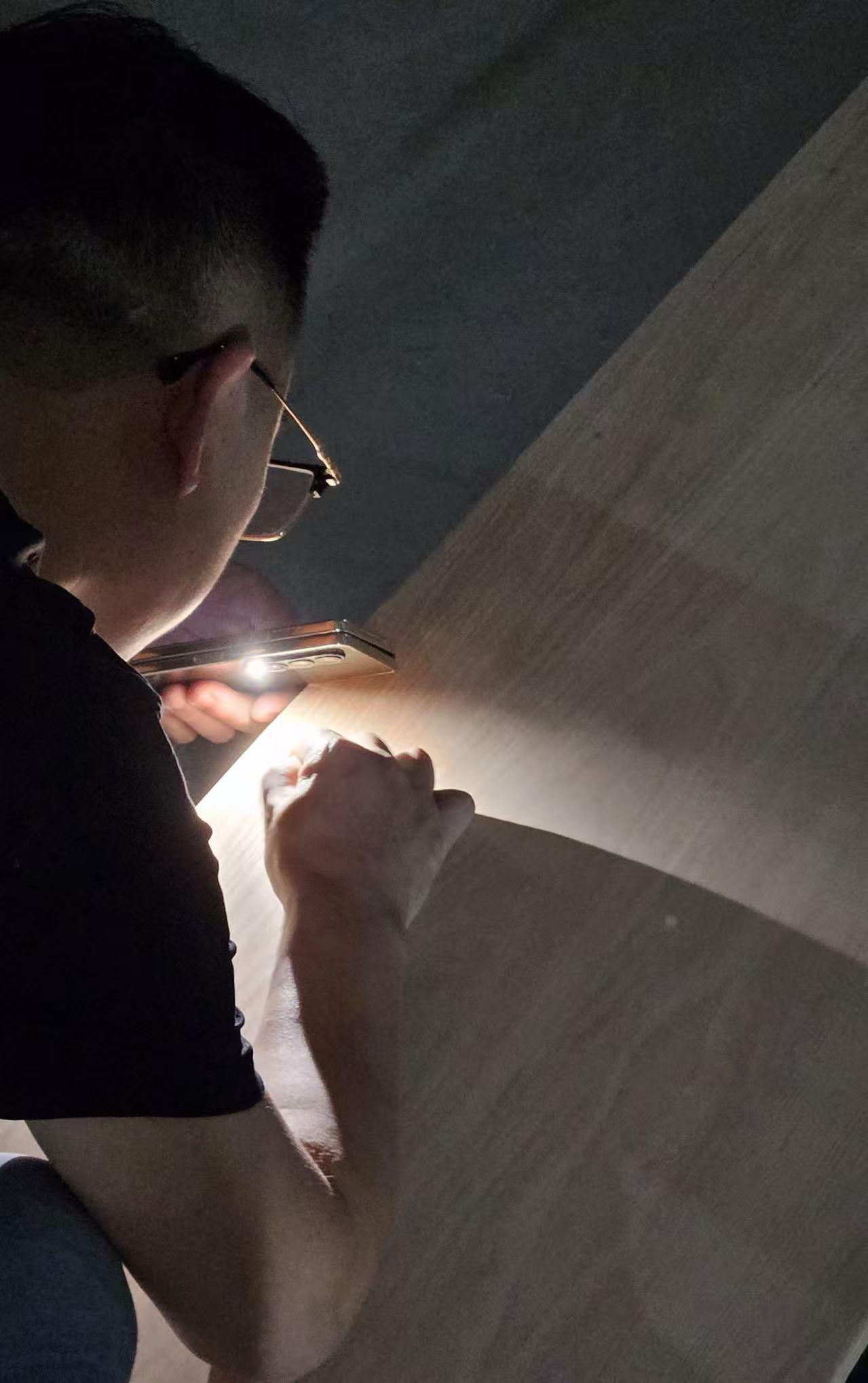 Furniture surface being inspected under direct light