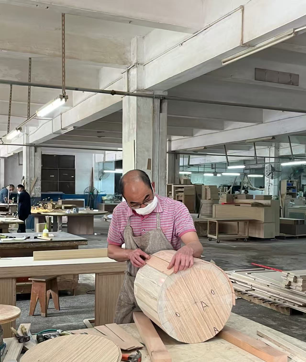 Furniture craft detail being checked during production